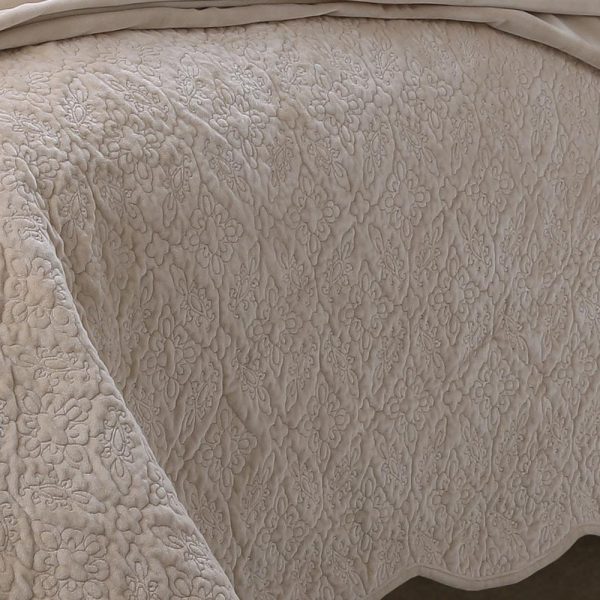 beige intricately quilted bedcover cum quilt