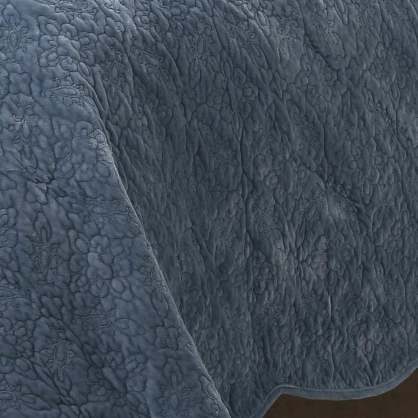 blue intricately quilted velvet bedcover