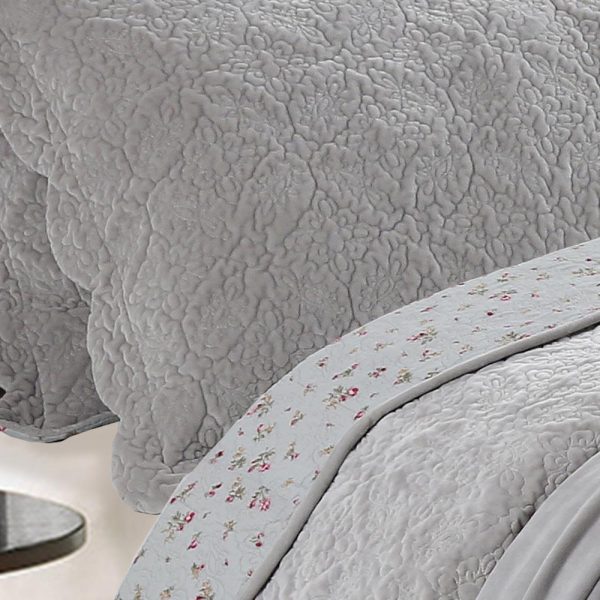 grey intricately quilted velvet bedcover