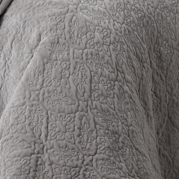 grey intricately quilted velvet bedcover