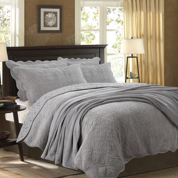 grey intricately quilted velvet bedocver